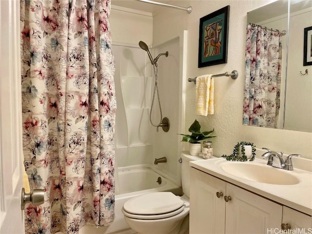 bathroom featuring toilet, a textured wall, vanity, and shower / bath combination with curtain