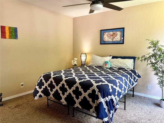 bedroom with baseboards, carpet flooring, and ceiling fan
