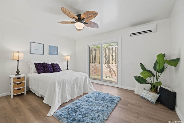 92-1158 Makamai Loop, Kapolei, HI 96707 - bedroom featuring a wall mounted air conditioner, access to exterior, wood finished floors, and a ceiling fan