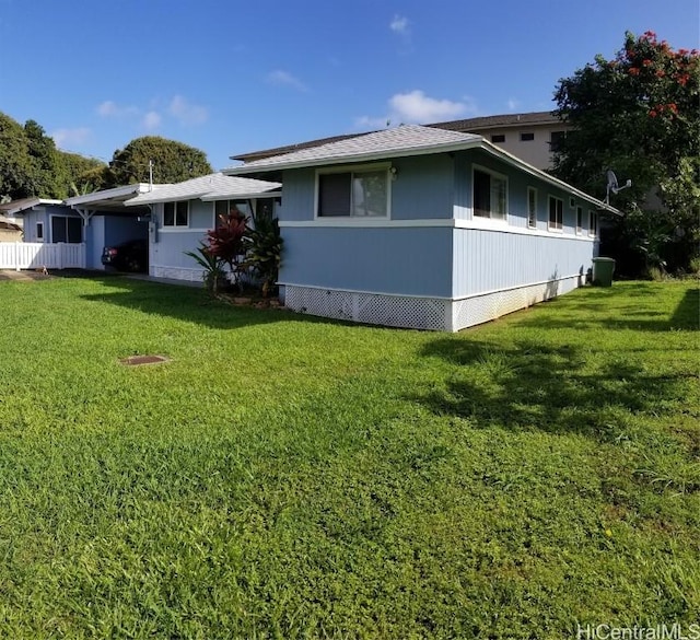 36 Ilima St, Wahiawa, HI 96786 - view of side of home featuring an attached carport and a lawn