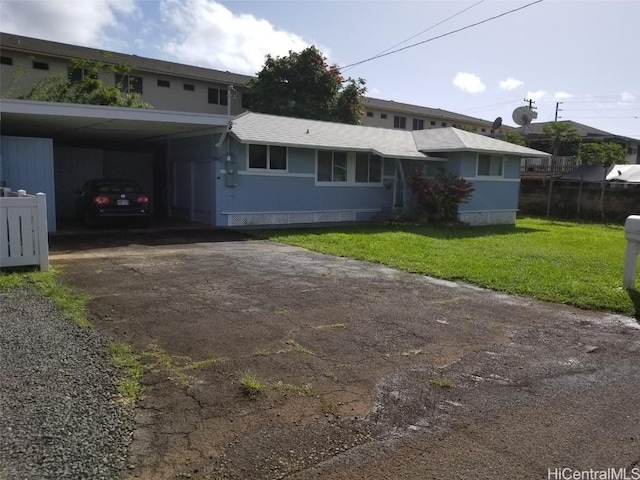 36 Ilima St, Wahiawa, HI 96786 - view of front of house with an attached carport, a front yard, and aphalt driveway