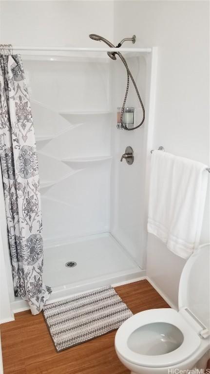 36 Ilima St, Wahiawa, HI 96786 - full bath with toilet, wood finished floors, and a shower stall