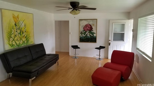36 Ilima St, Wahiawa, HI 96786 - sitting room with wood finished floors and a ceiling fan
