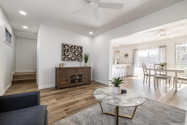 living room with recessed lighting, ceiling fan, and wood finished floors