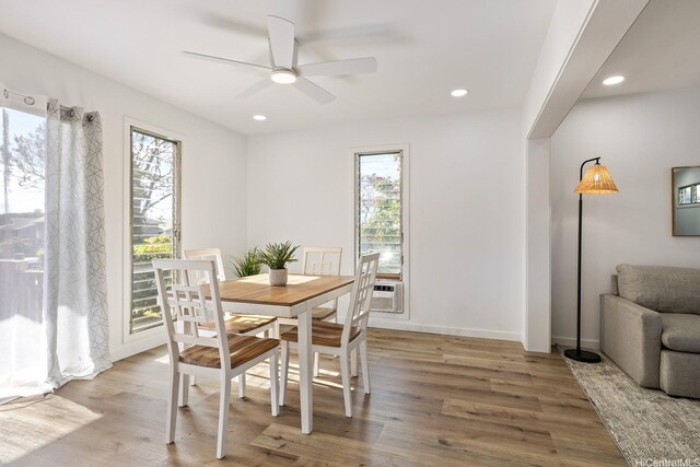 dining space featuring baseboards, recessed lighting, wood finished floors, and a ceiling fan