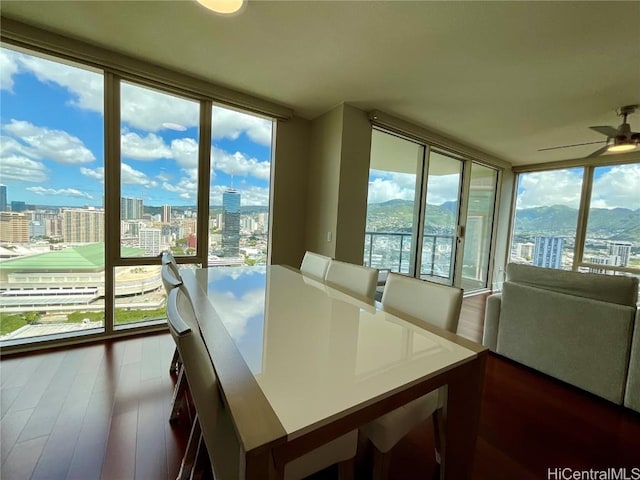 sunroom / solarium featuring a city view