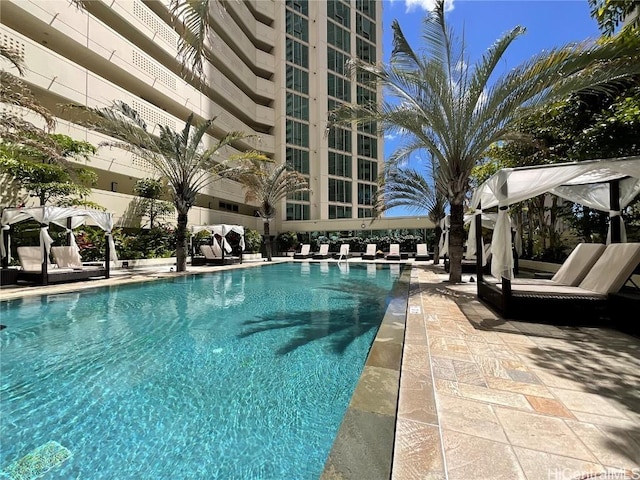 community pool with a patio area