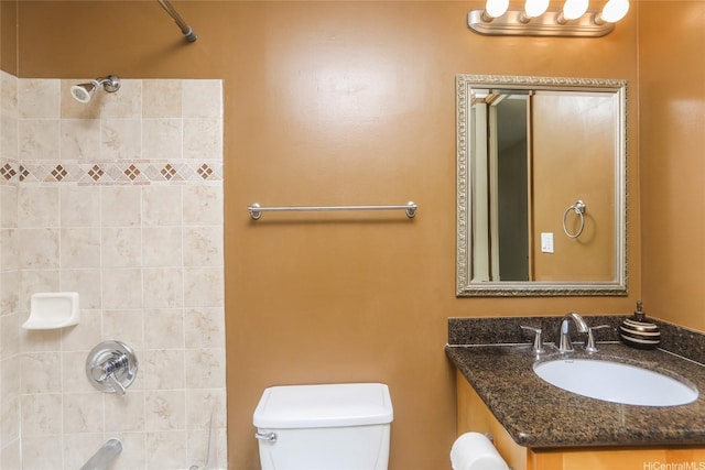 bathroom with toilet, vanity, and shower / bath combination