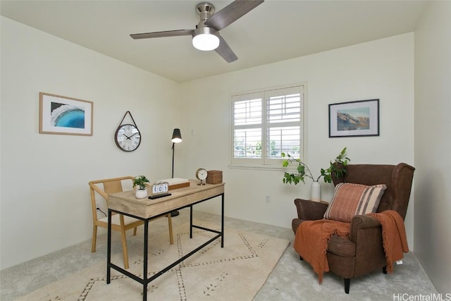office featuring light carpet and ceiling fan