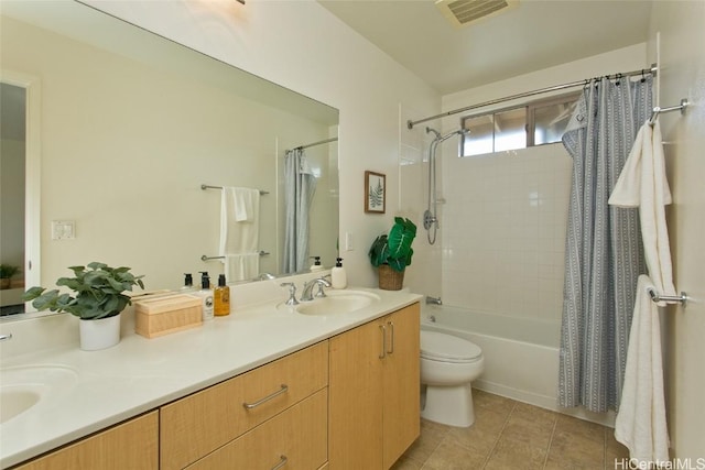 full bathroom featuring visible vents, a sink, shower / bath combo with shower curtain, tile patterned floors, and double vanity
