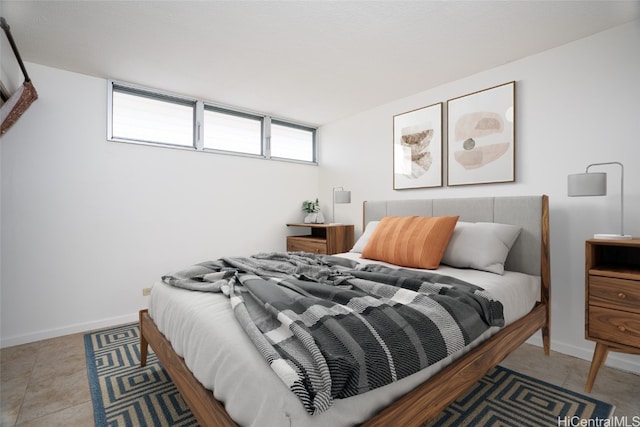tiled bedroom with baseboards