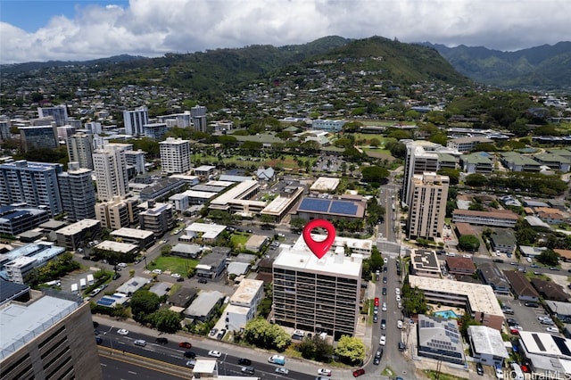 birds eye view of property with a mountain view