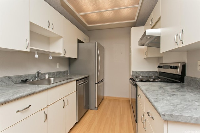 kitchen featuring stainless steel appliances, a sink, light wood-type flooring, range hood, and open shelves