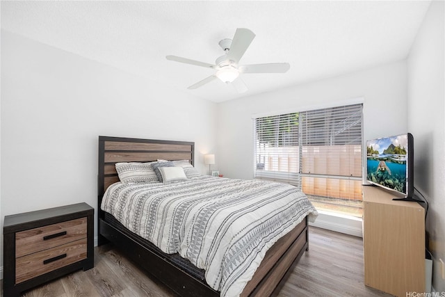 bedroom featuring a ceiling fan and wood finished floors