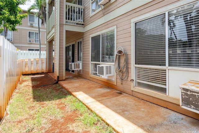 exterior space featuring fence and cooling unit