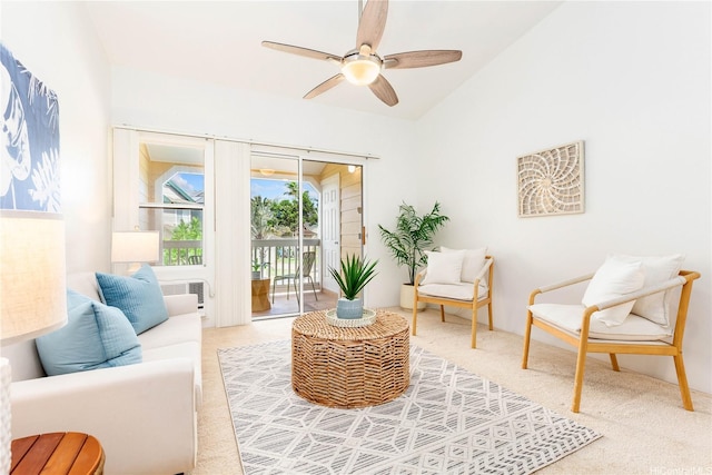 sitting room featuring ceiling fan, carpet, and lofted ceiling
