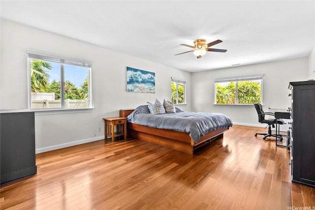 1000 Kaolo St, Honolulu, HI 96825 - bedroom with light wood-style flooring and a ceiling fan