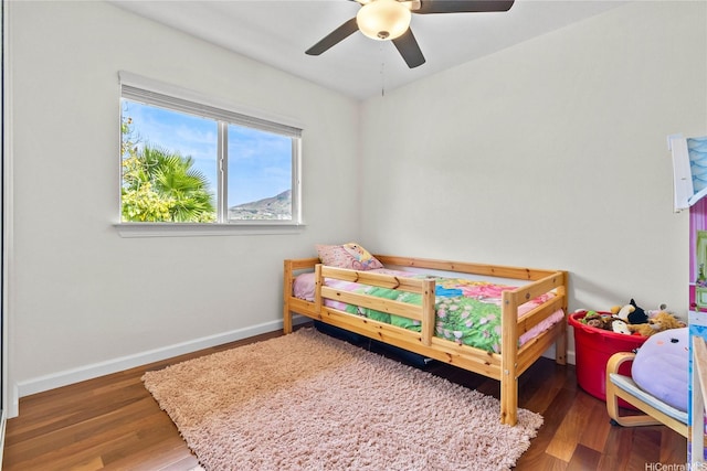 1000 Kaolo St, Honolulu, HI 96825 - bedroom featuring ceiling fan, baseboards, and wood finished floors