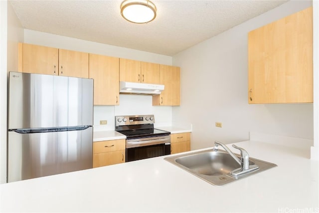 kitchen featuring a sink, light brown cabinets, appliances with stainless steel finishes, and under cabinet range hood