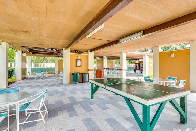 view of patio with fence and outdoor dining space