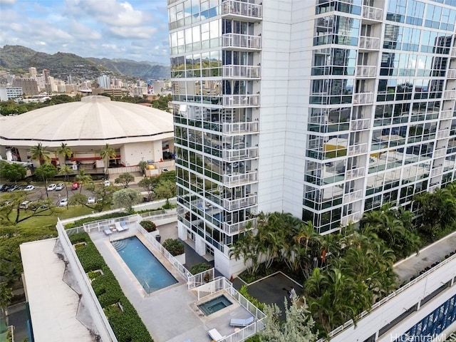 view of property with a city view and a mountain view