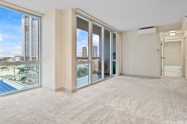 carpeted spare room with a city view, baseboards, floor to ceiling windows, and an AC wall unit