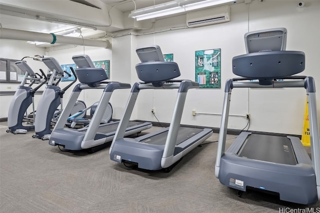 gym featuring a wall unit AC