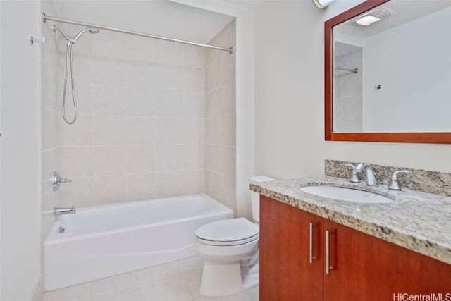 full bath featuring tile patterned flooring, vanity, toilet, visible vents, and washtub / shower combination