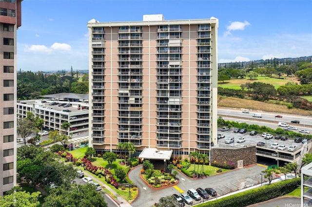 98-450 Koauka Loop Unit 201, Aiea, HI 96701 - view of apartment building / complex featuring uncovered parking