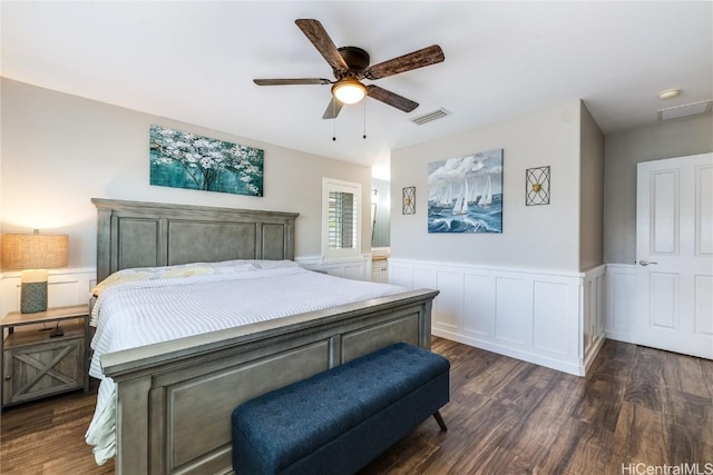 bedroom with visible vents, a ceiling fan, wainscoting, and dark wood finished floors