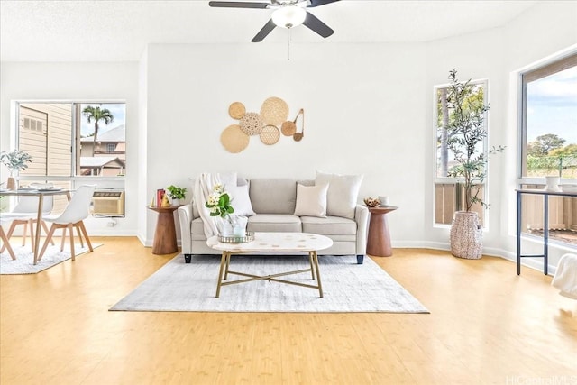 91-490 Puamaeole St Unit 46C, Ewa Beach, HI 96706 - living area featuring a ceiling fan, wood finished floors, and baseboards