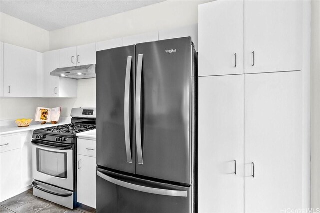 91-490 Puamaeole St Unit 46C, Ewa Beach, HI 96706 - kitchen featuring stainless steel appliances, under cabinet range hood, light countertops, and white cabinetry