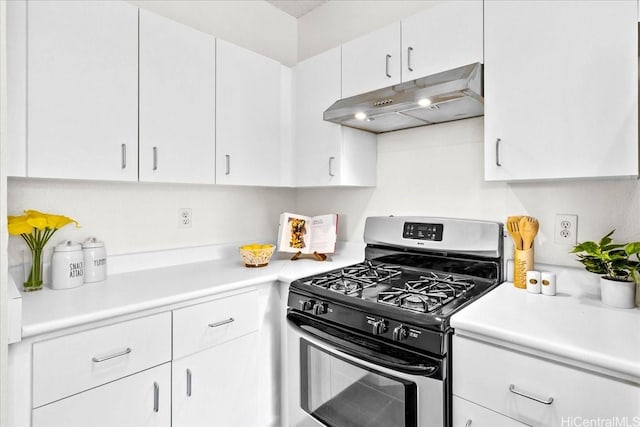 91-490 Puamaeole St Unit 46C, Ewa Beach, HI 96706 - kitchen featuring stainless steel gas stove, under cabinet range hood, light countertops, and white cabinets