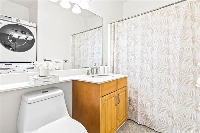 91-490 Puamaeole St Unit 46C, Ewa Beach, HI 96706 - full bath with stacked washer and clothes dryer, tile patterned flooring, toilet, and vanity