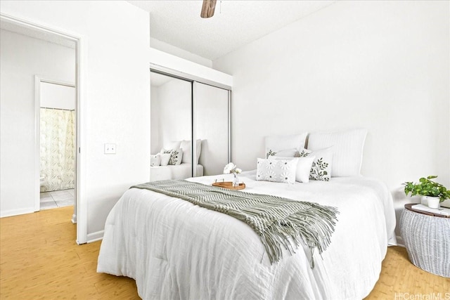 91-490 Puamaeole St Unit 46C, Ewa Beach, HI 96706 - bedroom featuring a closet, wood finished floors, a ceiling fan, and baseboards