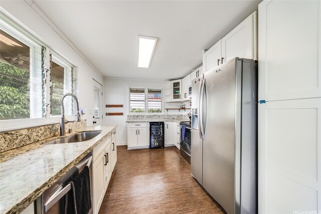 1924 10th Ave, Honolulu, HI 96816 - kitchen featuring appliances with stainless steel finishes, a sink, wine cooler, light stone countertops, and white cabinets