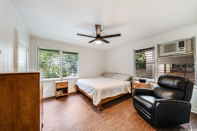 1924 10th Ave, Honolulu, HI 96816 - bedroom featuring multiple windows, ornamental molding, an AC wall unit, wood finished floors, and baseboards