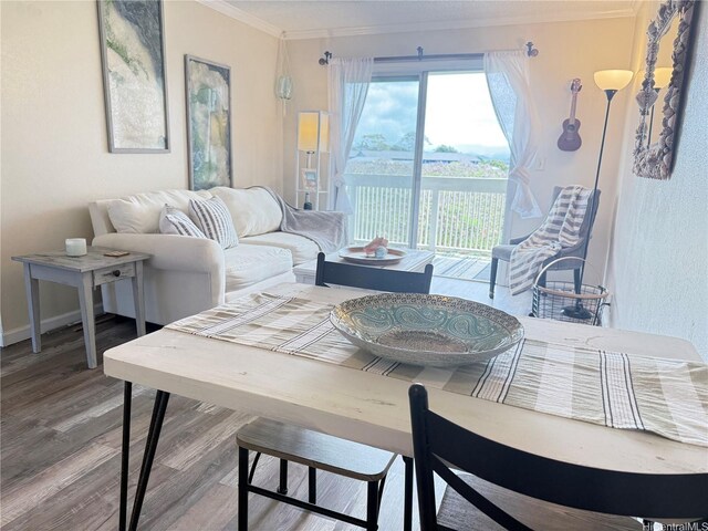 94-637 Kahakea St Unit 3I, Waipahu, HI 96797 - dining space featuring ornamental molding and wood finished floors