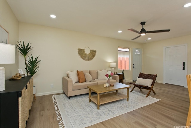 living room with ceiling fan, baseboards, light wood-type flooring, and recessed lighting