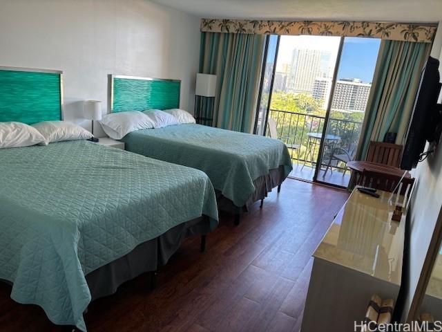 1850 Ala Moana Blvd Unit 818, Honolulu, HI 96815 - bedroom featuring wood finished floors, access to exterior, and multiple windows