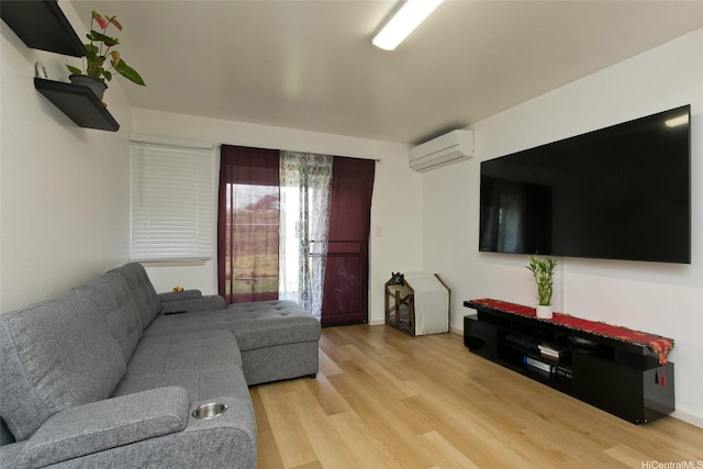 98-640 Moanalua Loop Unit 1024, Aiea, HI 96701 - living area with a wall mounted air conditioner, light wood finished floors, and baseboards