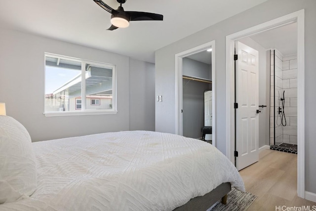 bedroom with a closet, ceiling fan, and wood finished floors