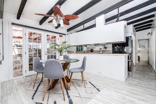 dining room featuring light wood-style floors, beam ceiling, french doors, and a ceiling fan