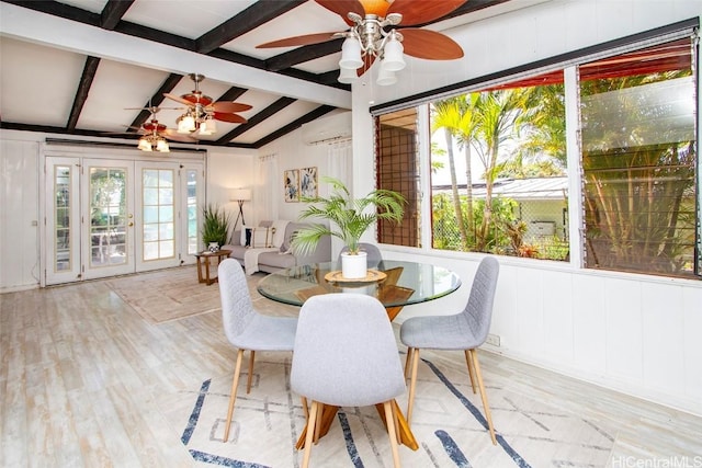 dining space with french doors, lofted ceiling with beams, wood finished floors, a wall mounted air conditioner, and ceiling fan
