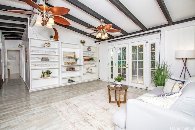 living room featuring light wood finished floors, lofted ceiling with beams, french doors, and a ceiling fan