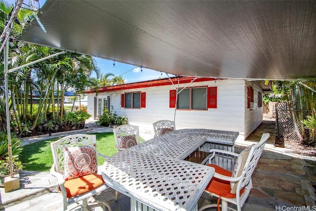 view of patio / terrace with cooling unit and outdoor dining area