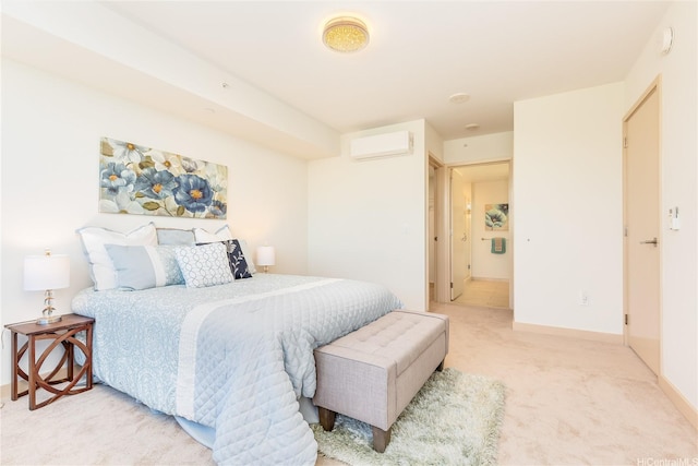bedroom featuring light carpet, a wall mounted AC, and baseboards