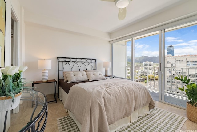 419 Atkinson Dr Unit 1603, Honolulu, HI 96814 - bedroom featuring access to exterior, light tile patterned floors, a city view, a ceiling fan, and a mountain view
