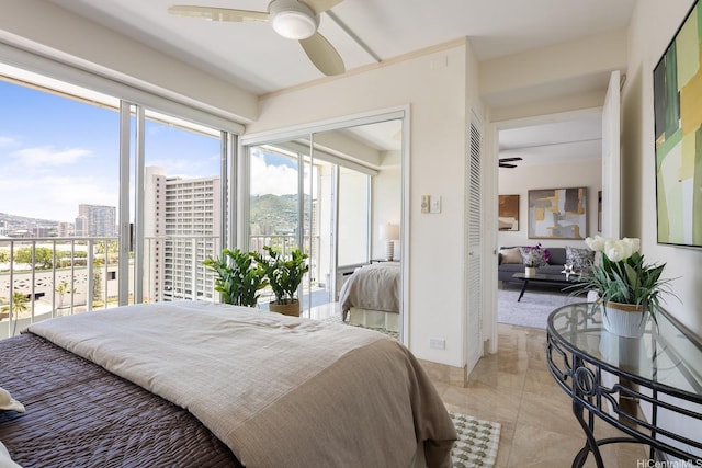 419 Atkinson Dr Unit 1603, Honolulu, HI 96814 - bedroom featuring a view of city, access to outside, a ceiling fan, and a closet