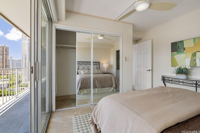 419 Atkinson Dr Unit 1603, Honolulu, HI 96814 - bedroom featuring multiple windows, access to outside, a closet, and a ceiling fan